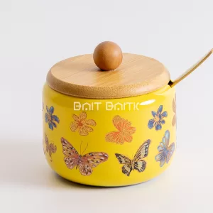 سكّرية الفراشات الصفراء بغطاء خشبي وملعقة ذهبية – Yellow Butterfly Sugar Jar with Bamboo Lid